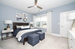 carpeted bedroom featuring baseboards and ceiling fan