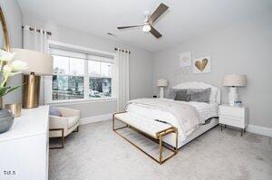 carpeted bedroom with baseboards and ceiling fan