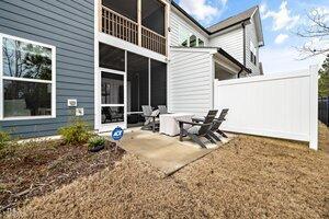 back of property featuring a patio area and a sunroom