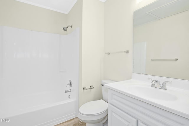 bathroom featuring toilet, washtub / shower combination, ornamental molding, and vanity