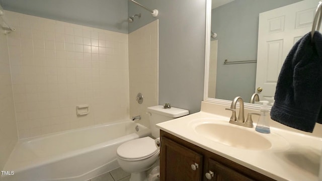 bathroom with tile patterned floors, vanity, toilet, and  shower combination