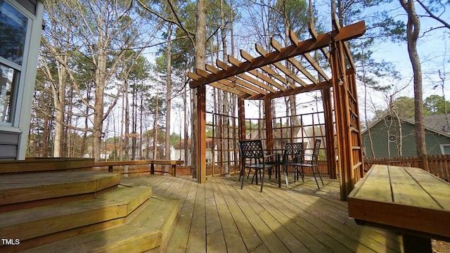 wooden deck featuring outdoor dining area and a pergola