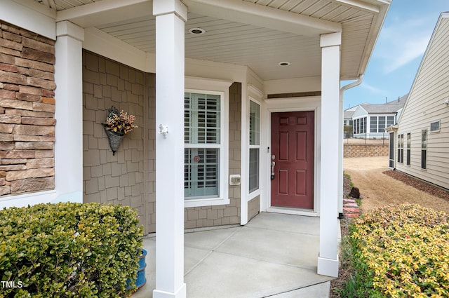 entrance to property featuring a porch