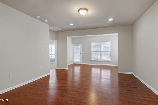 unfurnished room with visible vents, recessed lighting, baseboards, and wood finished floors