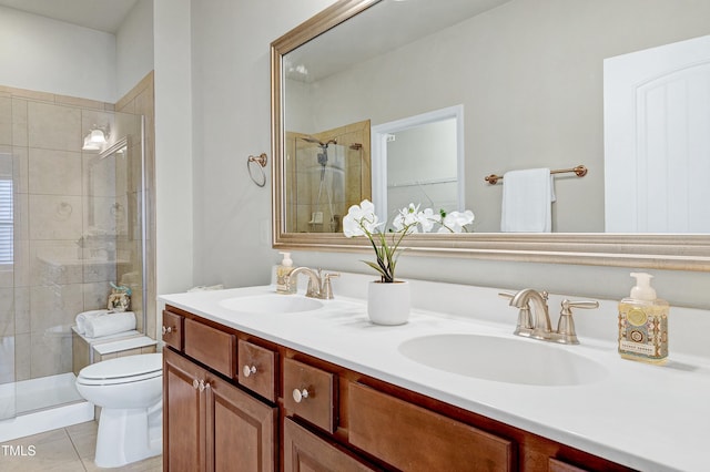 full bathroom with tile patterned floors, toilet, a stall shower, and a sink