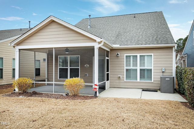 rear view of property with central air condition unit, a patio, and a sunroom