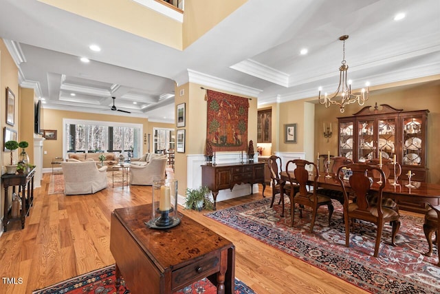 dining area with recessed lighting, light wood-style floors, coffered ceiling, and ornamental molding