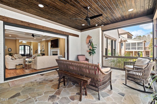 view of patio featuring an outdoor hangout area and a ceiling fan