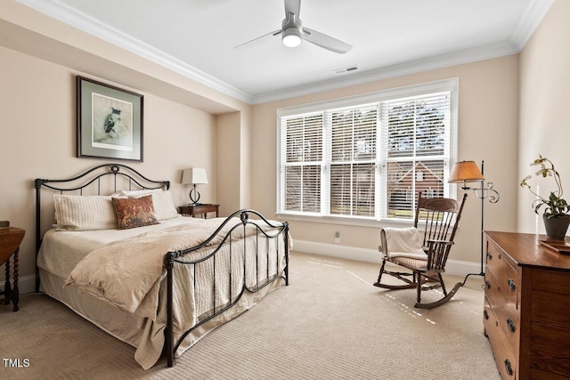 bedroom featuring visible vents, a ceiling fan, crown molding, baseboards, and light colored carpet