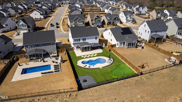 birds eye view of property with a residential view