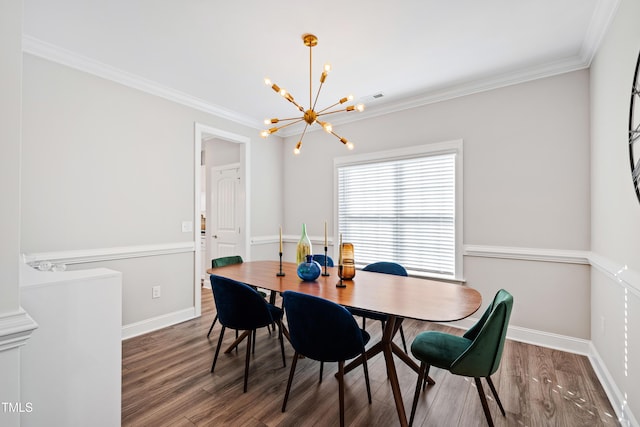 dining room featuring baseboards, wood finished floors, an inviting chandelier, and ornamental molding