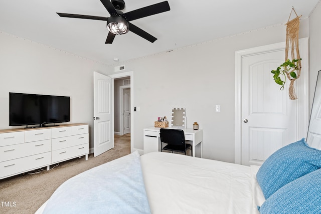 bedroom featuring light carpet, visible vents, baseboards, and ceiling fan