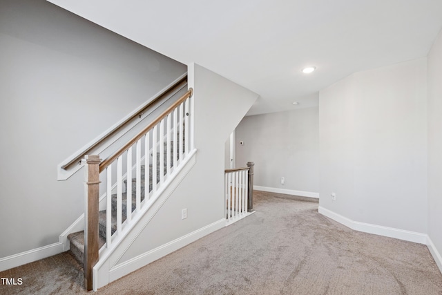 staircase with carpet and baseboards