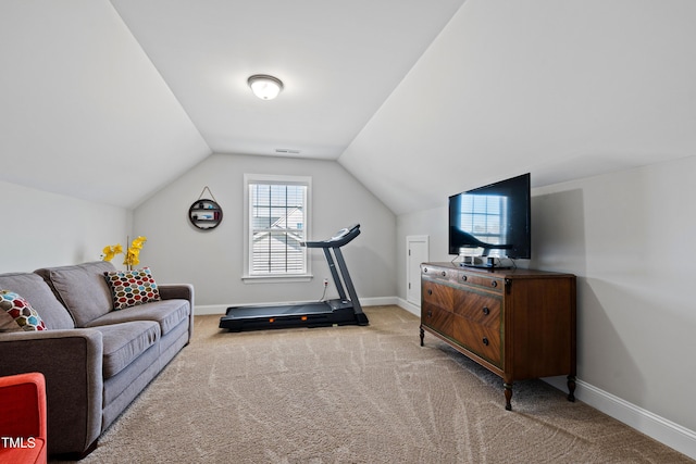 workout area featuring vaulted ceiling, carpet, baseboards, and visible vents