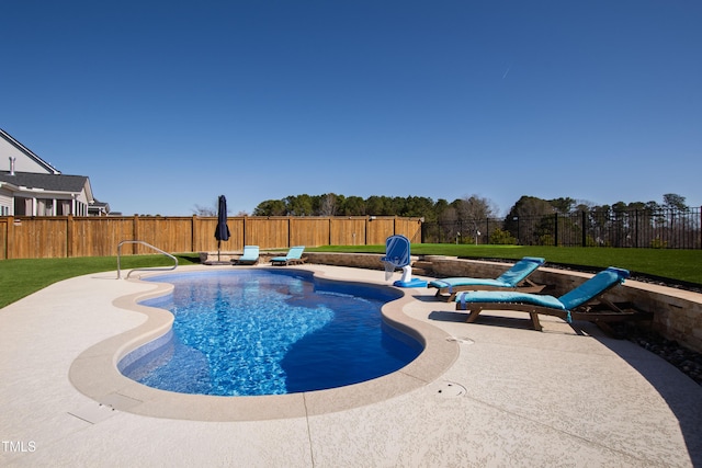 view of pool featuring a fenced backyard, a fenced in pool, a lawn, and a patio