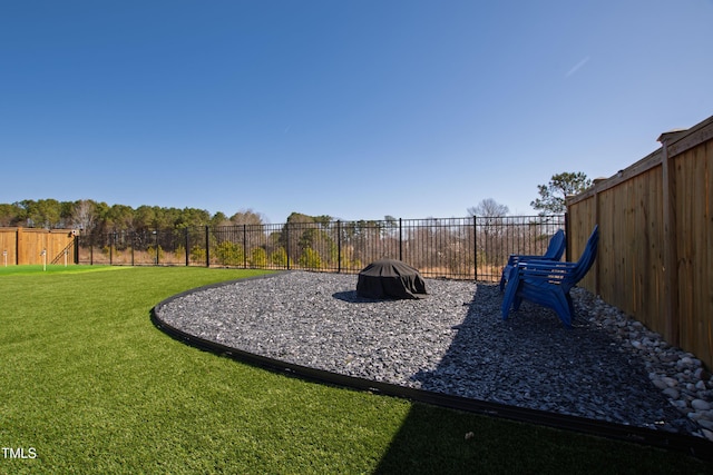 view of playground with a fenced backyard and a yard