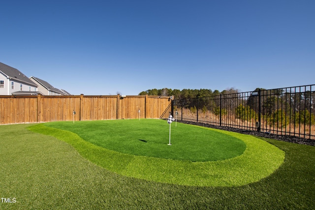 view of yard with a fenced backyard