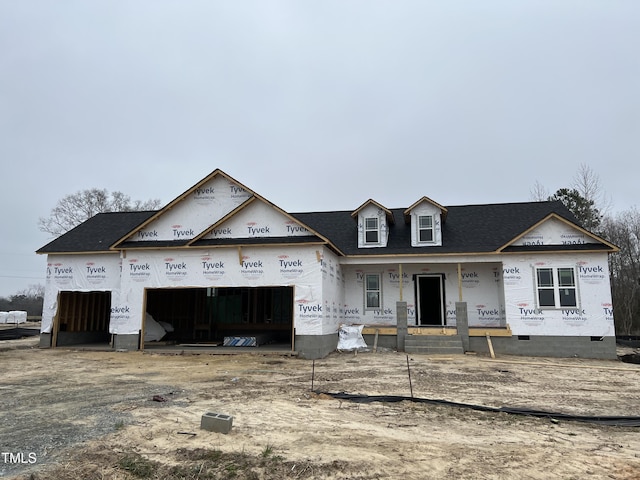 property under construction with a garage, a porch, and a shingled roof