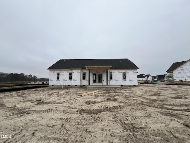 back of property featuring crawl space