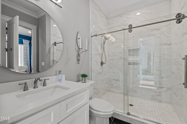 full bathroom featuring vanity, toilet, a stall shower, and crown molding