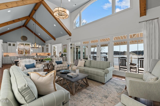 living area with beamed ceiling, recessed lighting, wood finished floors, a notable chandelier, and high vaulted ceiling