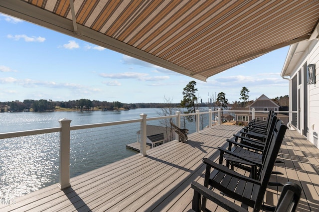 view of dock with a water view and a balcony