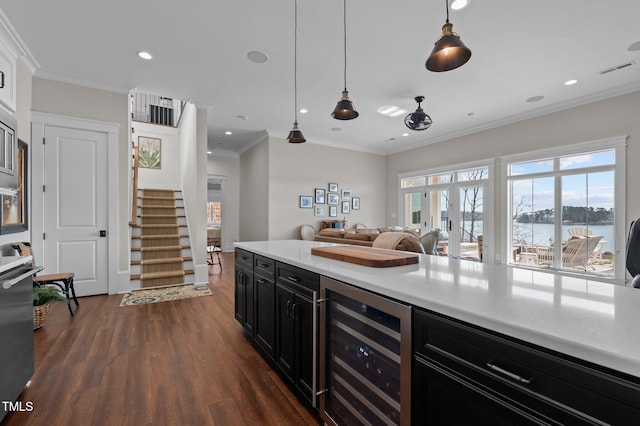 kitchen with dark wood-style floors, visible vents, light countertops, wine cooler, and dark cabinets