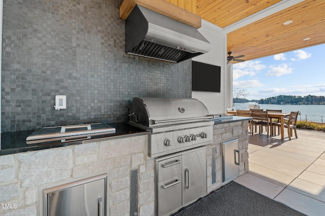 view of patio featuring outdoor dining area, area for grilling, and ceiling fan