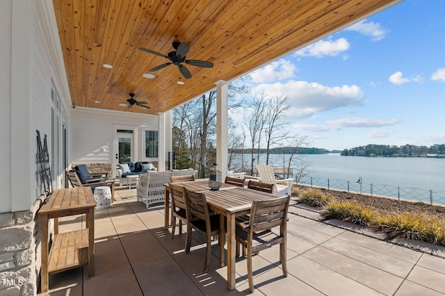 view of patio featuring an outdoor living space, outdoor dining area, a ceiling fan, and a water view