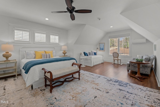 bedroom with a ceiling fan, wood finished floors, lofted ceiling, recessed lighting, and an AC wall unit