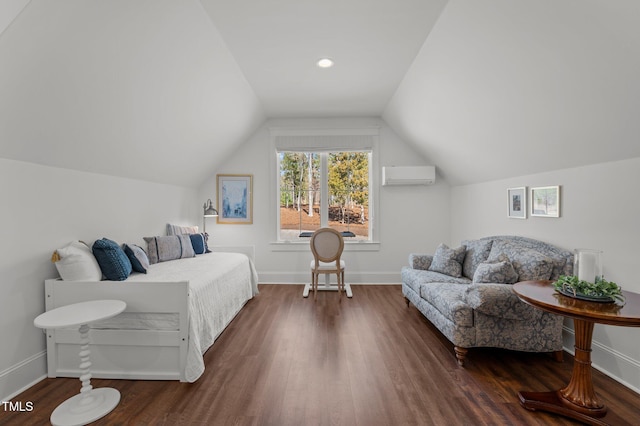 bedroom featuring lofted ceiling, wood finished floors, baseboards, and a wall mounted AC