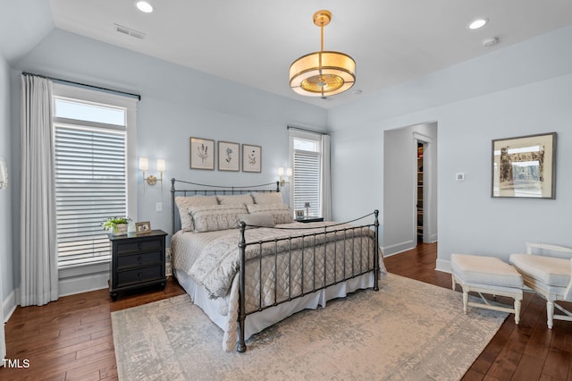 bedroom with visible vents, recessed lighting, baseboards, and hardwood / wood-style flooring