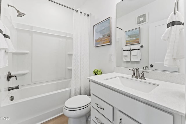 full bathroom featuring shower / bath combo with shower curtain, toilet, vanity, and wood finished floors