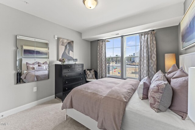 carpeted bedroom with visible vents and baseboards