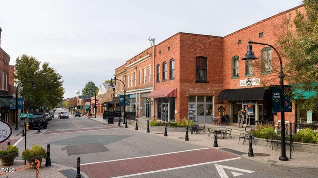 exterior space with sidewalks, curbs, and street lighting