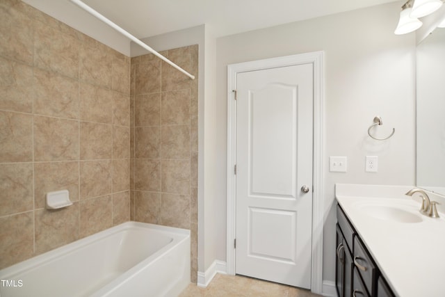 bathroom featuring tile patterned flooring, tub / shower combination, vanity, and baseboards