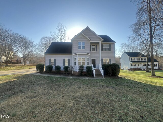 view of front of home with a front yard