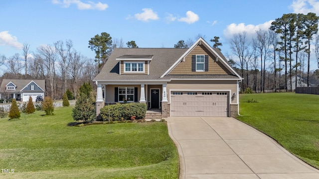 craftsman-style home featuring covered porch, a shingled roof, concrete driveway, a front lawn, and a garage