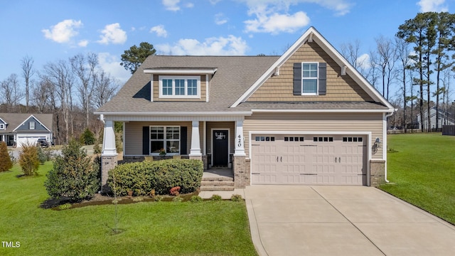 craftsman inspired home featuring driveway, a front lawn, a porch, roof with shingles, and an attached garage