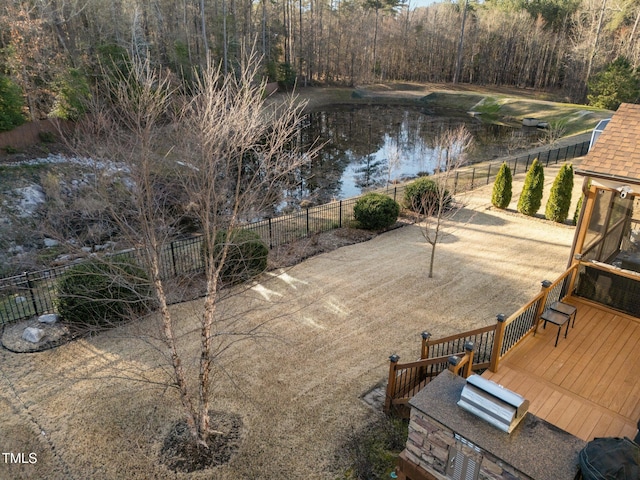 exterior space featuring a view of trees and a water view