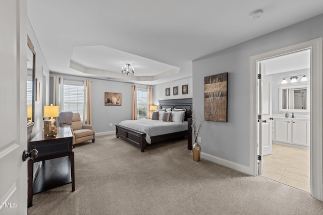 tiled bedroom featuring carpet flooring, multiple windows, and a tray ceiling