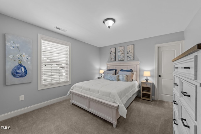 bedroom featuring visible vents, baseboards, and carpet