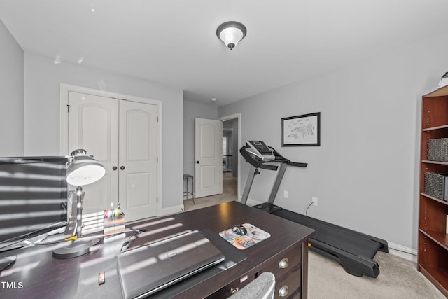 workout room with baseboards