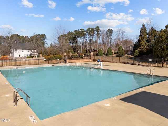 pool featuring a patio and fence