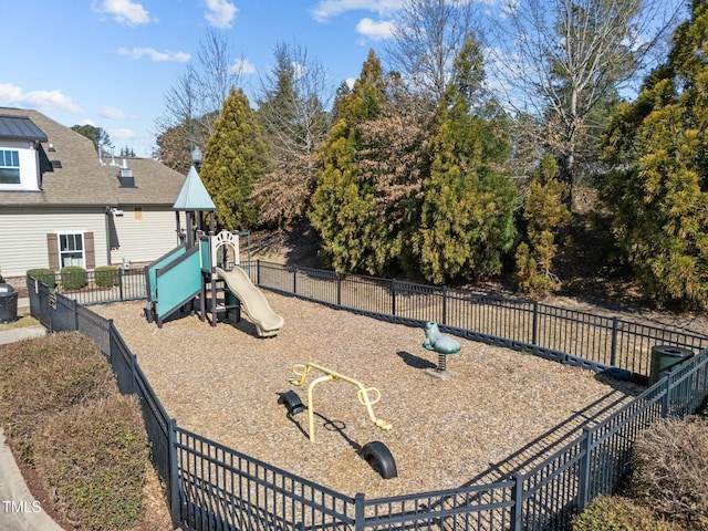 view of playground featuring fence