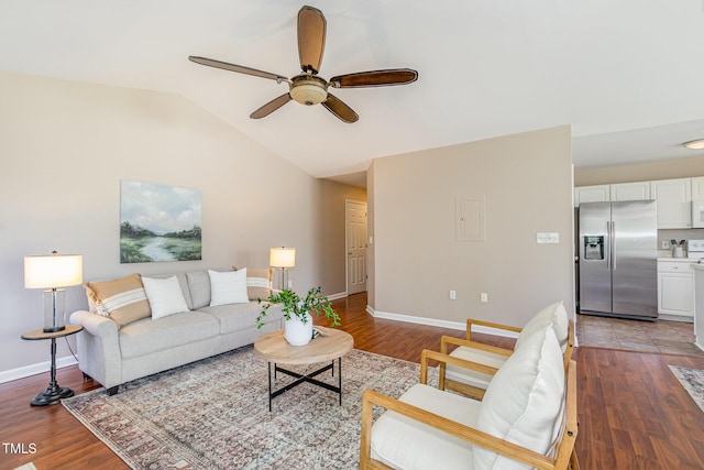 living room with vaulted ceiling, light wood-style flooring, a ceiling fan, and baseboards