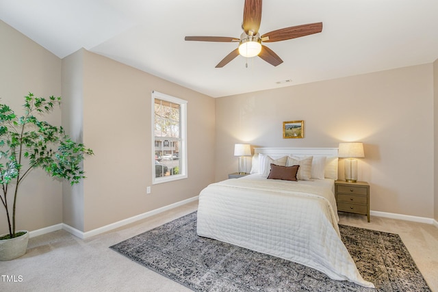 bedroom featuring visible vents, carpet floors, baseboards, and a ceiling fan