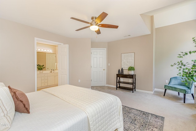 bedroom featuring a ceiling fan, baseboards, visible vents, light carpet, and connected bathroom