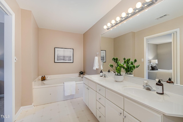 bathroom featuring a sink, visible vents, ensuite bathroom, and tile patterned floors