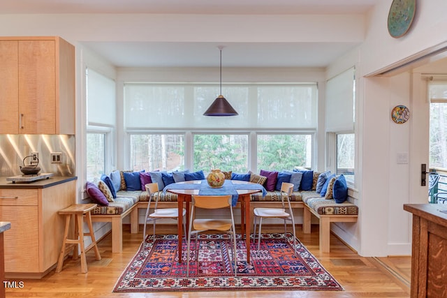 dining room featuring light wood-type flooring and breakfast area